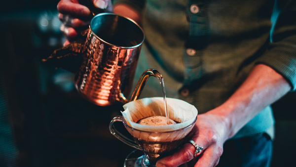 copper in water being poured from a jug
