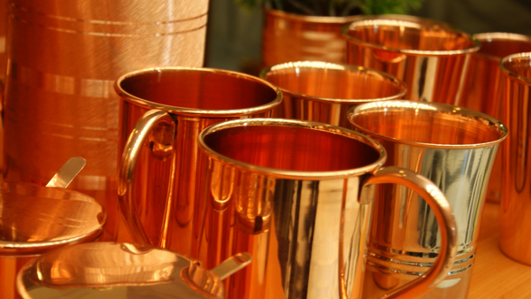 drinking from a copper cup